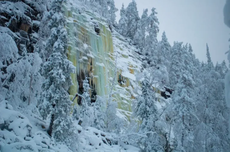 Ice climbing at Korouoma frozen waterfalls in Finnish Lapland during a guided Arctic adventure